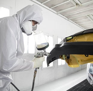 Collision Center Technician Painting a Vehicle | Performance Toyota in Sinking Spring PA